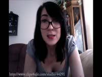 Twisted brunette teenage slut wears her glasses and talks nasty into camera for her viewers